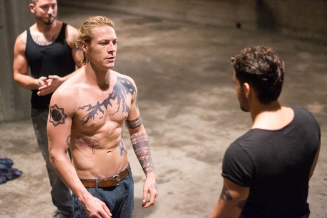 C'mon, Bodhi, why don't you take off your shirt, too? You know you wanna... Image courtesy of Warner Bros.
